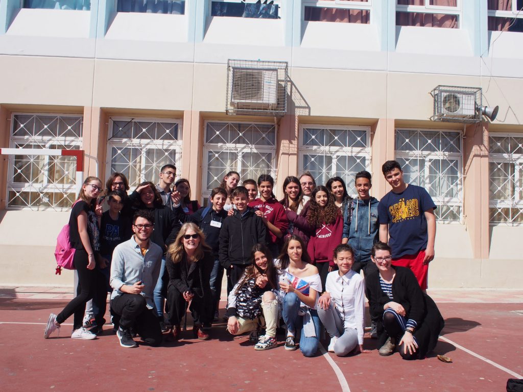 Group photo of collaborators in a schoolyard in Athens, Greece