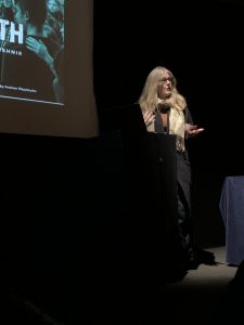 Dr. Kathleen Gallagher speaking on stage at the Royal Society of Canada