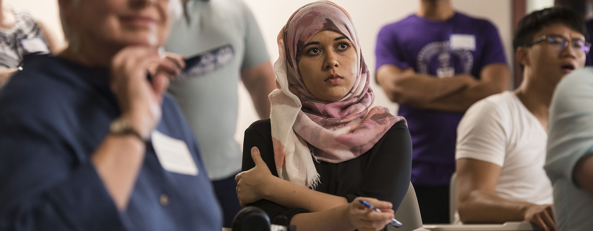 A student listening to a presentation.