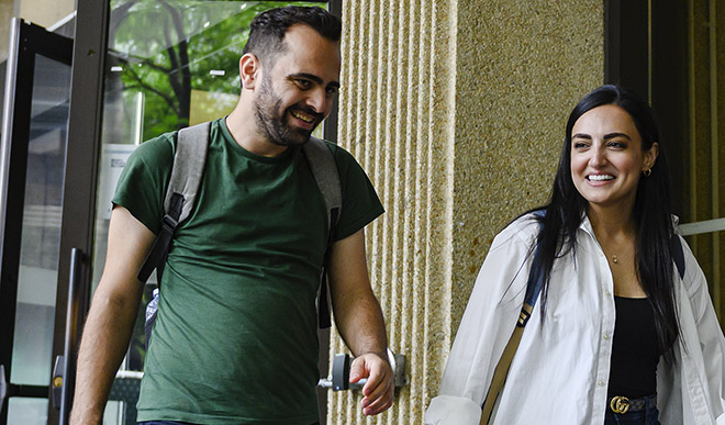 Two students walking and chatting at OISE Orientation.