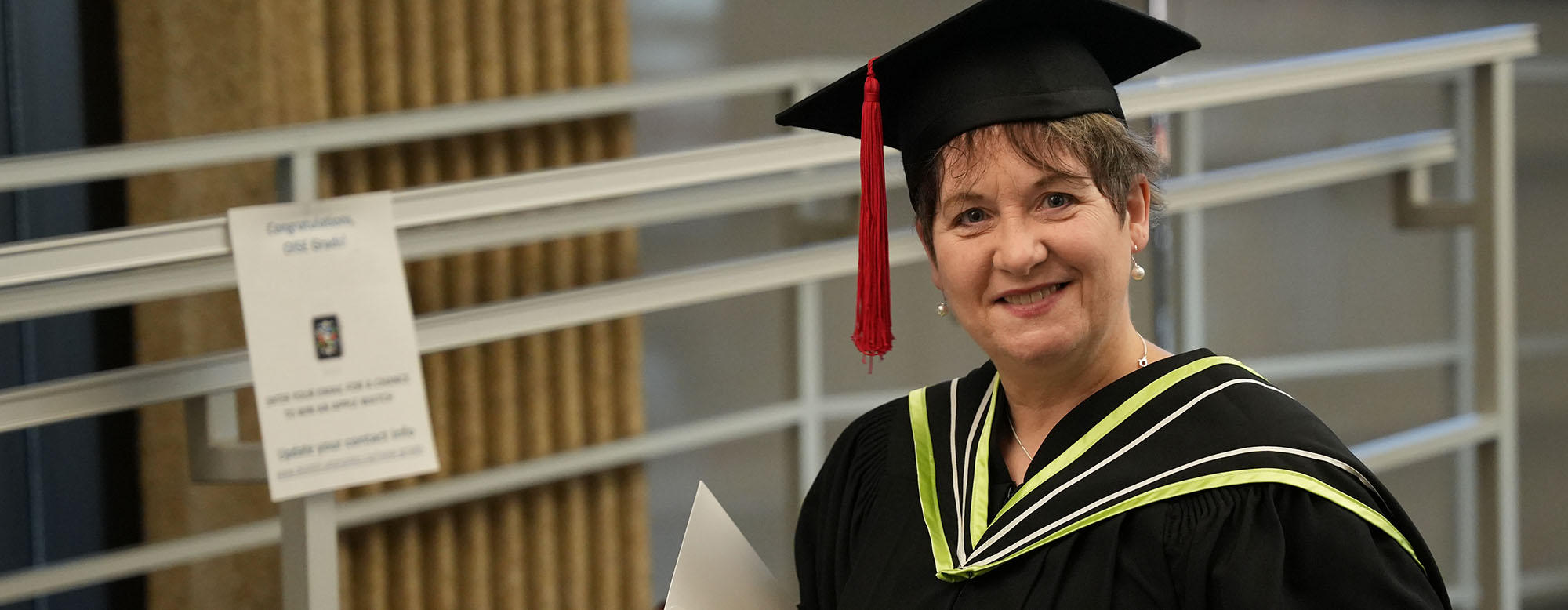An OISE graduate at OISE Swag Day.