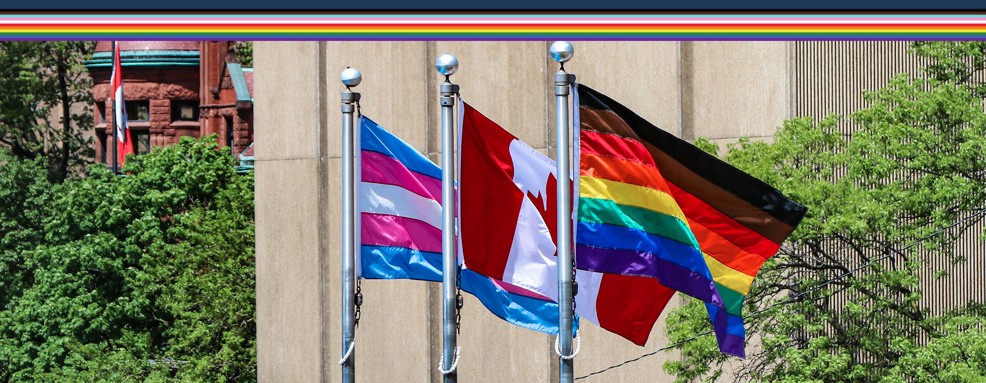 Pride flag raising ceremony at the University of Toronto St. George campus during pride week.