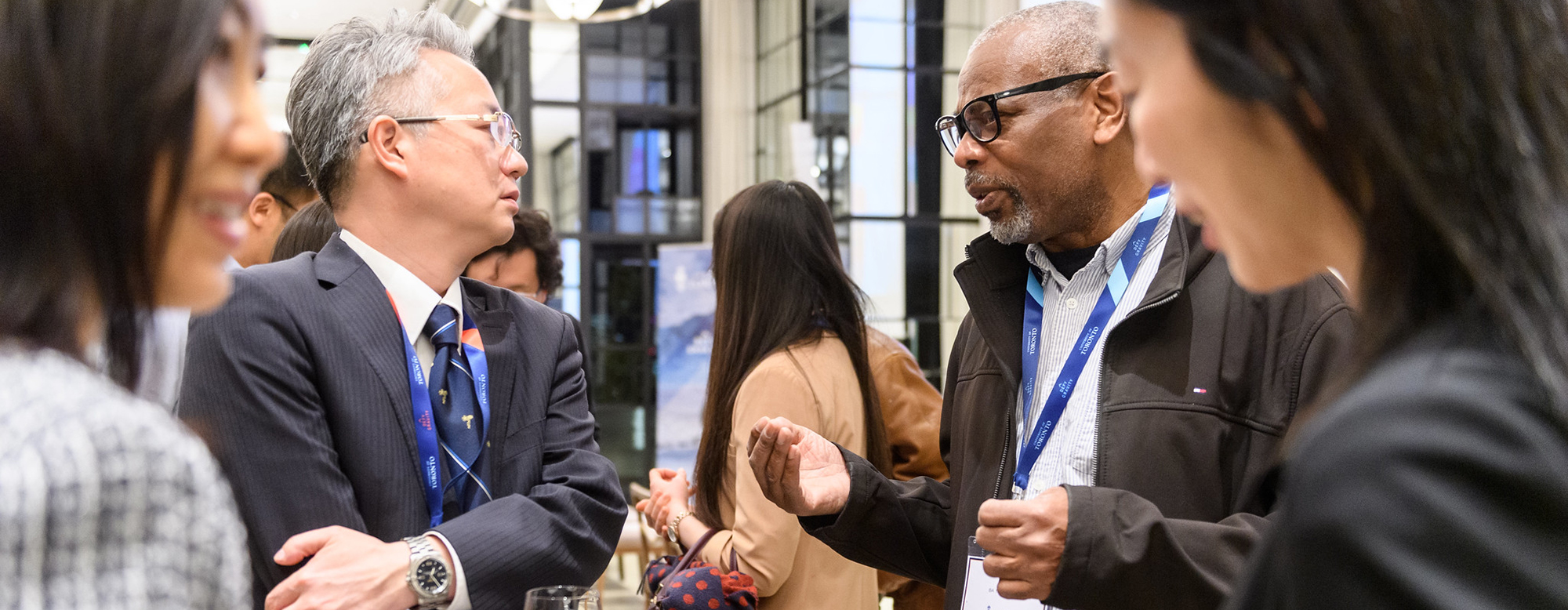 People socializing at an OISE Global Network event.
