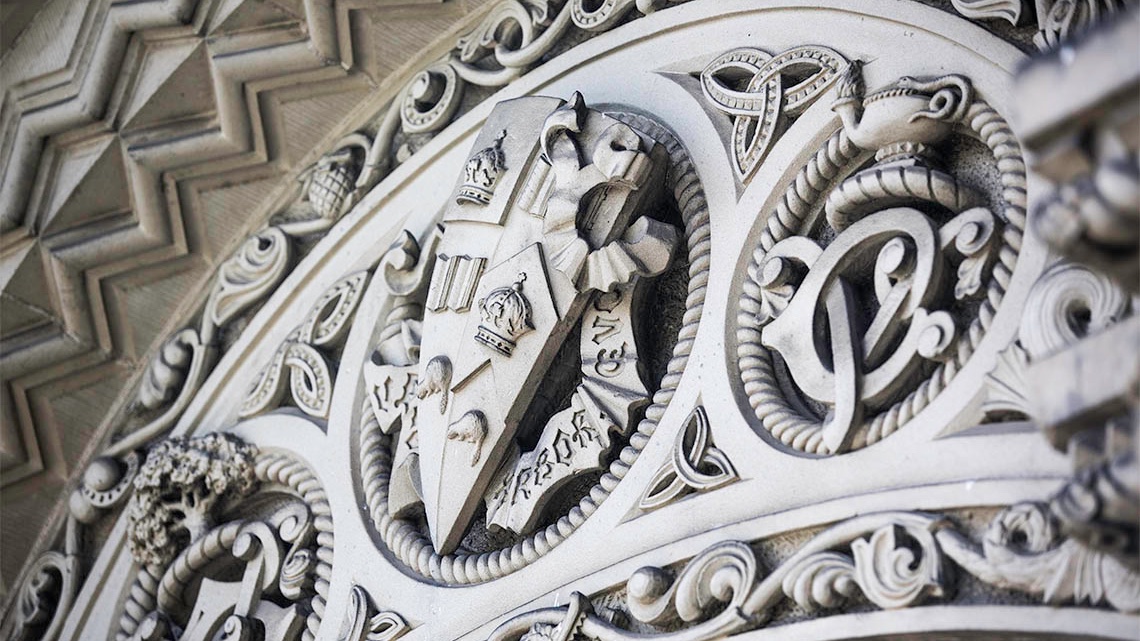 A close up of decorative facade at the University of Toronto
