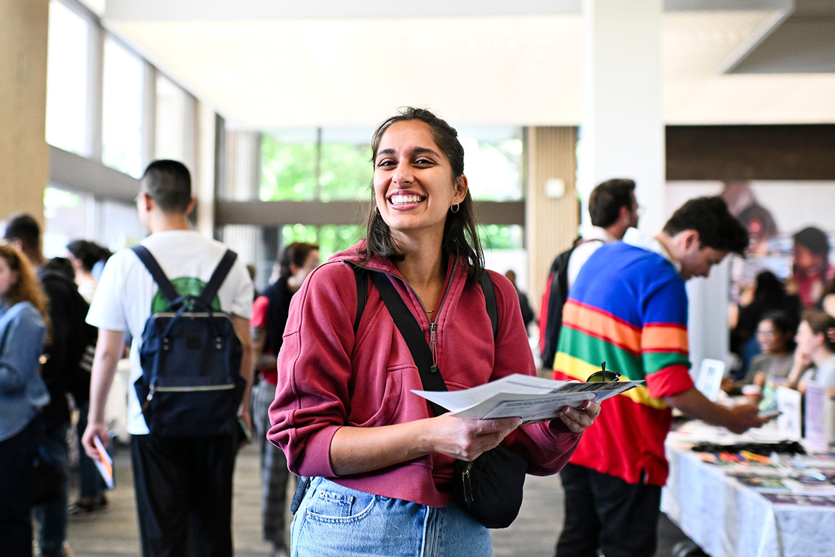 An OISE student is smiling