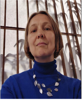 Picture of Kapitolina Fedorova. Woman in a blue shirt, looking at the camera.
