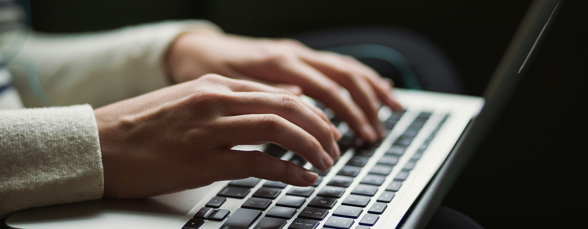 A person typing on a keyboard.