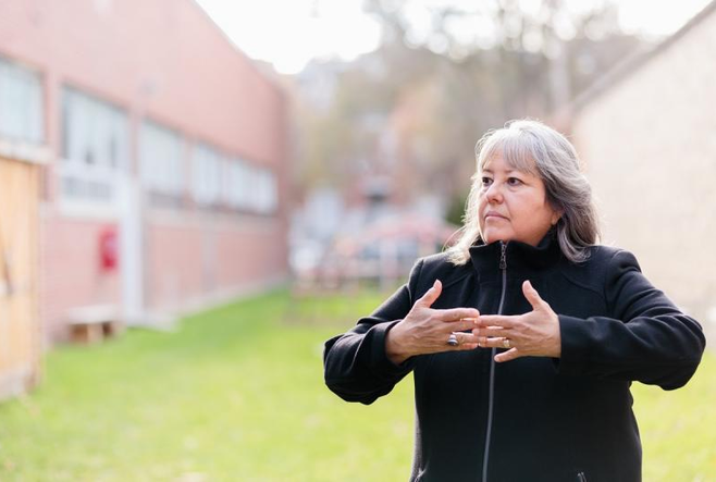 Kahontakwas Diane Longboat tours the Ceremony Grounds at the Centre for Addiction and Mental Health (CAMH), a healing space with sweat lodge, sacred fire and medicine garden to help clients recover from mental health challenges and addictions. Photo by Horst Herget.