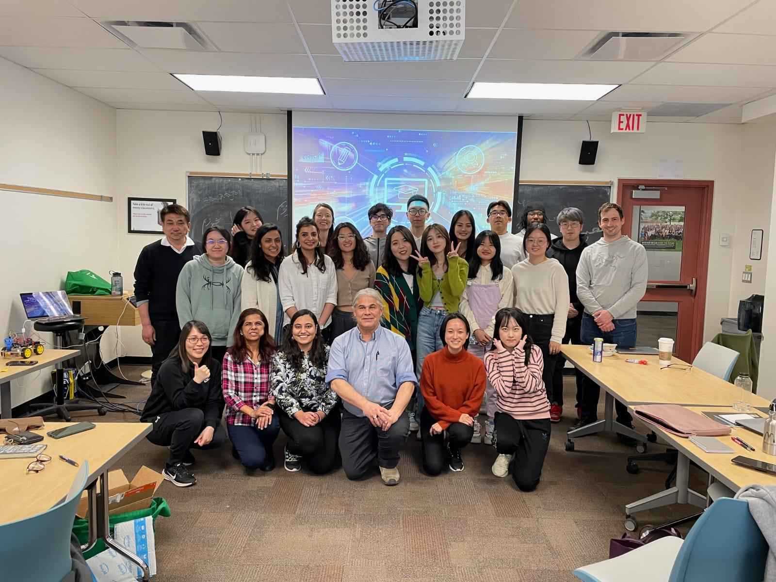 Full class of students posing with Professor Jim Slotta
