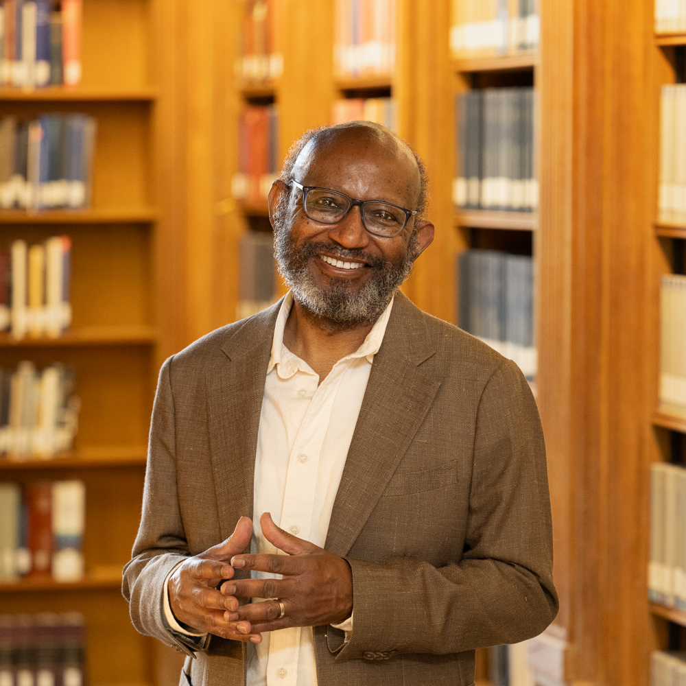 Photo of Samuel Lucas in a library