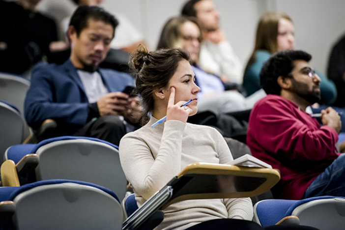 A group of people attending a lecture.