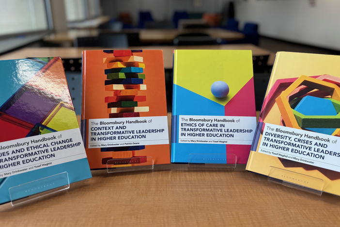 Picture of four books on a shelf
