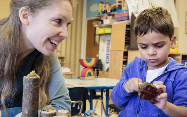 An educator helping a student. 