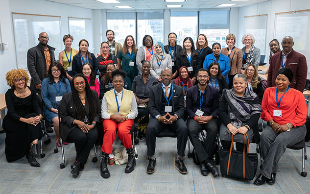 A group photo of individuals at the 4th Annual International Conference.