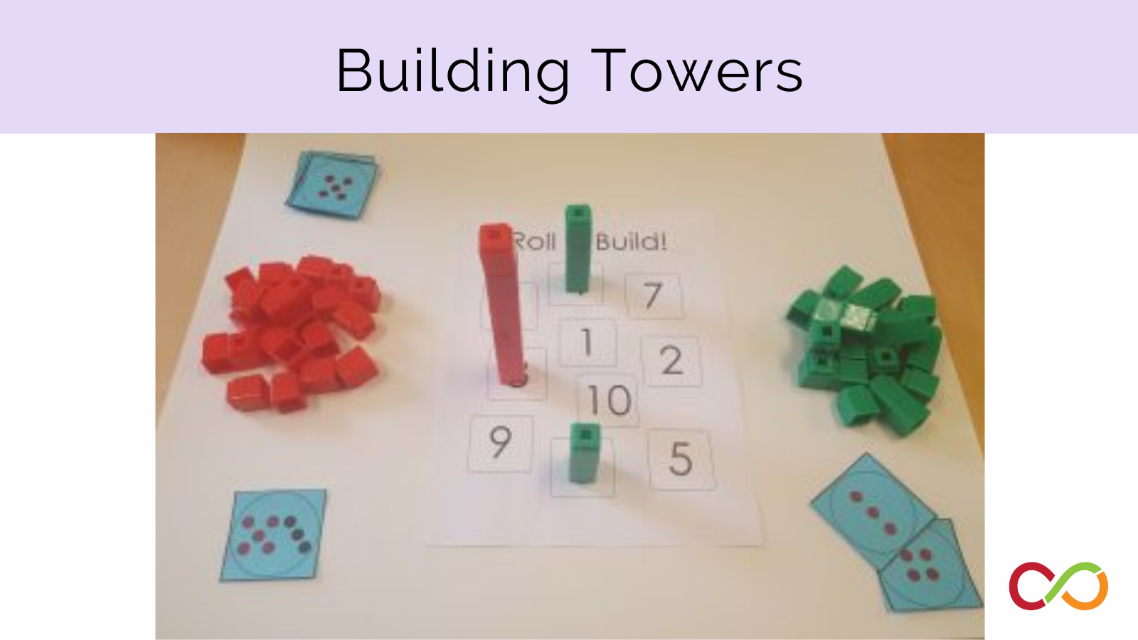 Two piles of green and red blocks with some stacked in the middle of the picture. A title reads, "Building Towers".