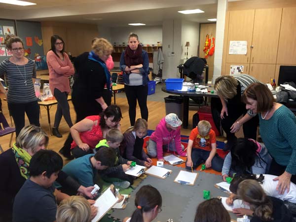 Educators work with students on the perspective lesson.