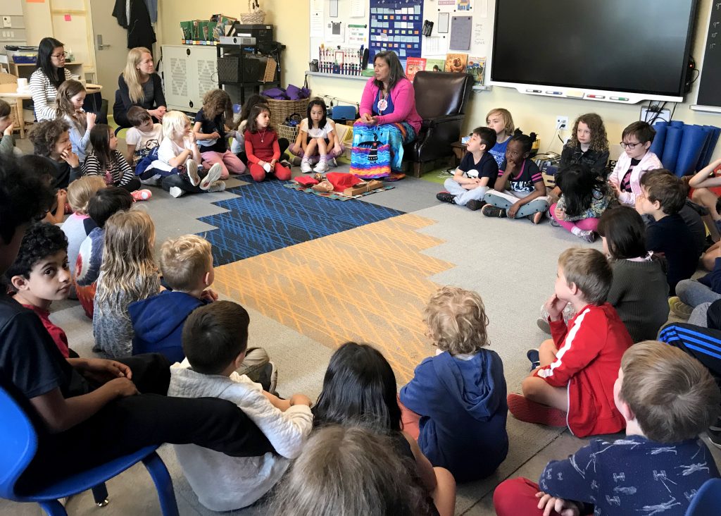 Liz shares her water walk story with the students