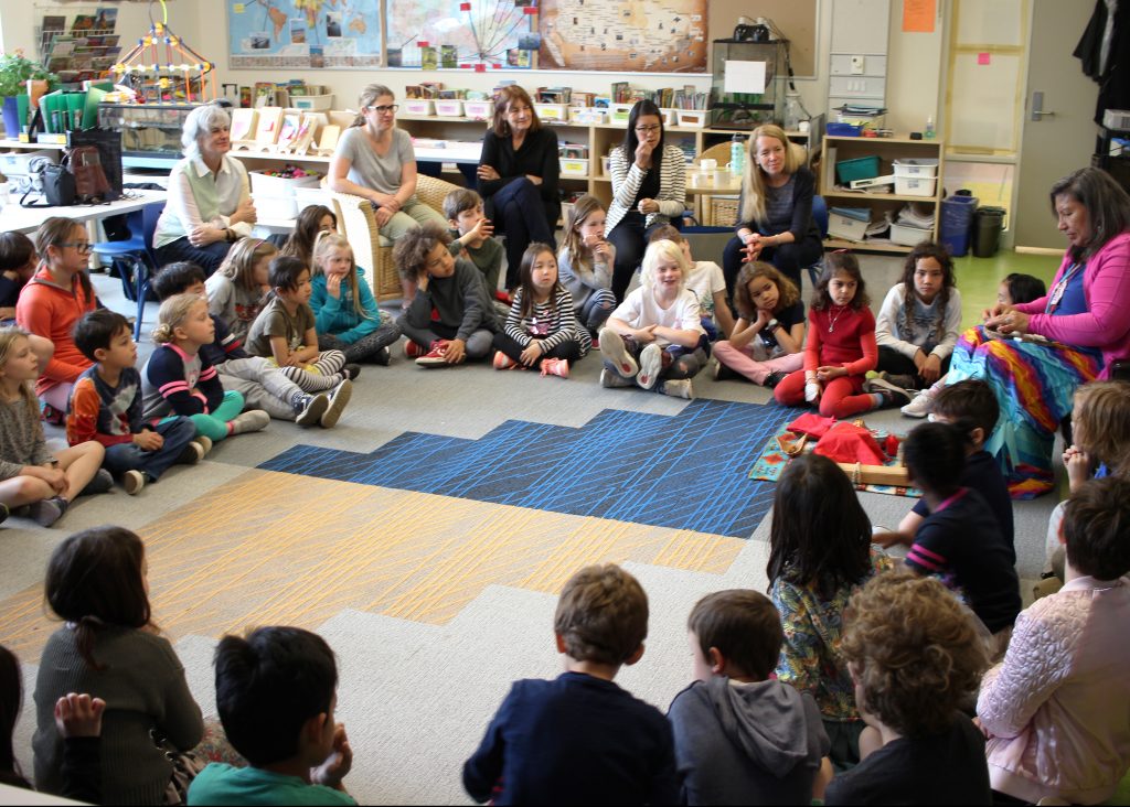 Liz Osawamick prepares the class to open the class with a smudge