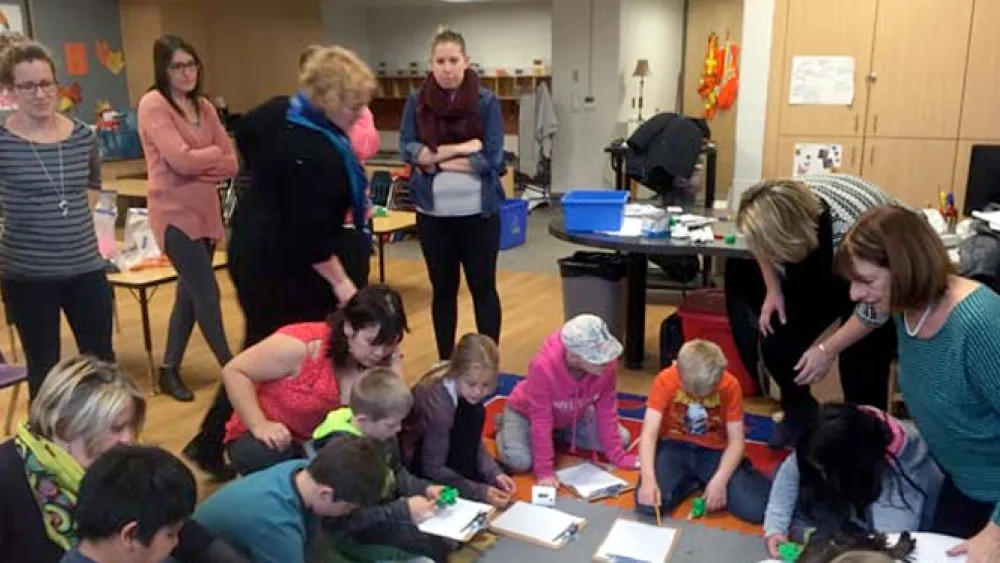 Educators work with students on the perspective lesson.