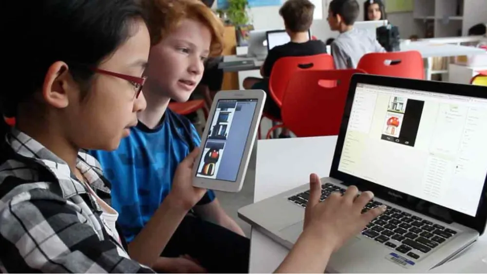 Kids Coding using laptop and handheld device