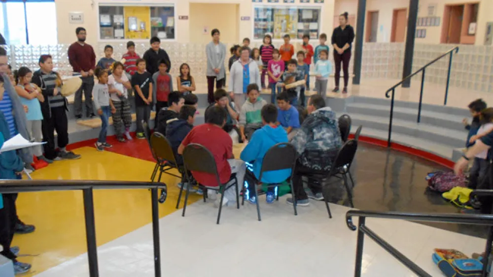 Migizi Wazisin drummers play in the school's atrium