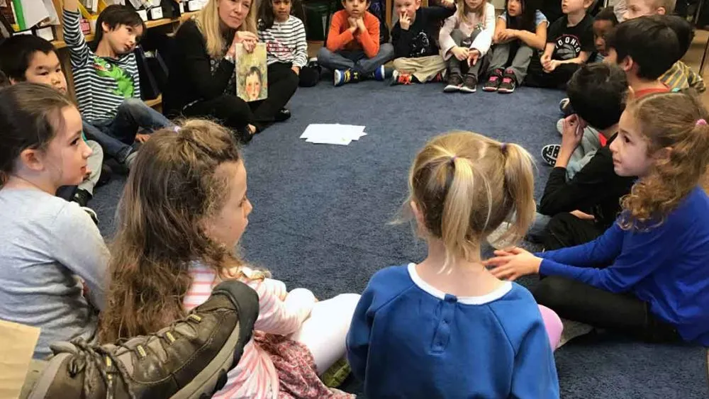Classroom discussion on the carpet about a book