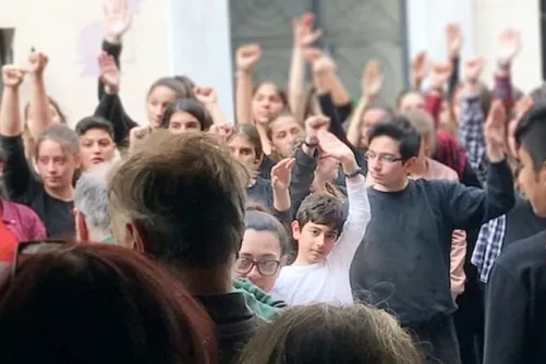 Youth in Greece showing solidarity by raising their fists
