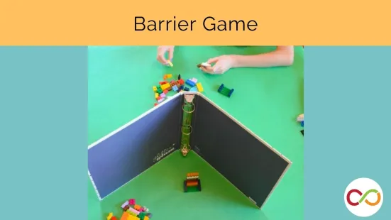 A binder dividing the space of two people and a title that reads, "Barrier Game".