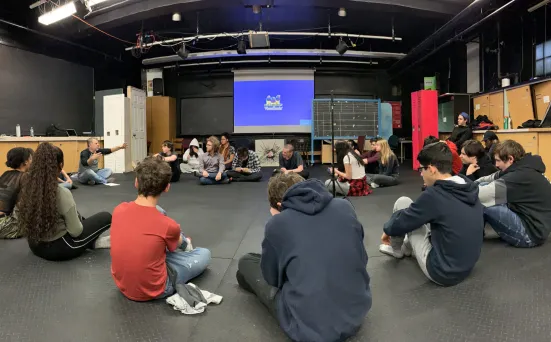 A group of people sitting in a circle