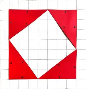 Four red triangles forming a box on a grid.