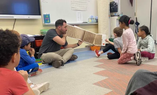 Educator David Osario reads One Grain of Salt to his Grade 2 class at the Dr. Eric Jackman Institute of Child Study.