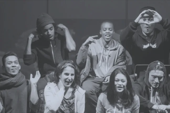 A group of actors performing on a stage