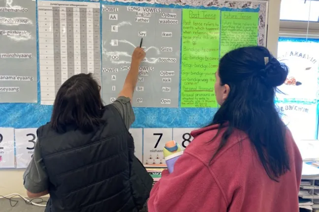 MA-CSE teacher candidate Myah Birrell learns about Anishinaabemowin from Aroland Ojibway teacher Pauline Gagnon.